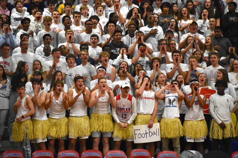 Centennials student section cheers at a Varsity basketball game.