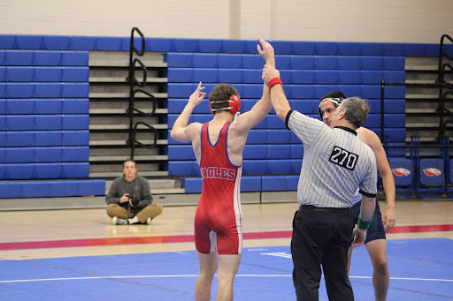 Schmitt gets his hand raised in victory.
