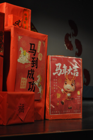A Lunar New Year motif in place on stage, representing good luck and welcoming in the year of the Horse.