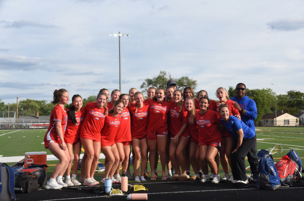 Centennial girls lacrosse celebrate after their state semifinal victory against Stephen Decatur.